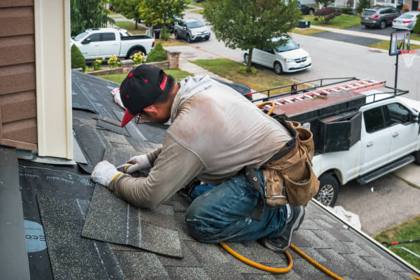 Professional Storm Damage Roof Repair technician working in Conroe, TX